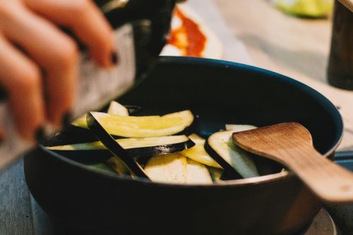 Cooking melitzanes (eggplant) with olive oil